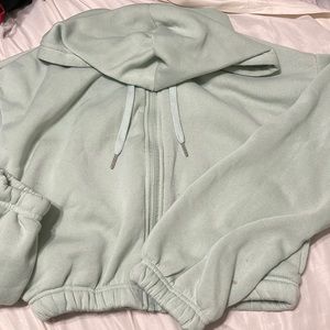 Cropped mint green hooded zip up.